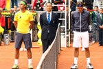 MADRID, SPAIN - MAY 07:  Rafael Nadal of Spain, Roger Federer of Switzerland and umpire Mohamed Lahyani in a minutes silence to tribute spanish golfing legend Seve Ballesteros following news of his death before his match against  during day eight of the Mutua Madrilena Madrid Open Tennis on May 7, 2011 in Madrid, Spain.  (Photo by Julian Finney/Getty Images)