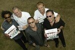 BAGSHOT, ENGLAND - SEPTEMBER 3:  Mike Tindall and Matt dawson pose with rock band UB40 during a press conference on September 3, 2003 at Pennyhill Park Hotel in Bagshot, England.  (Photo by Harry How/Getty Images)