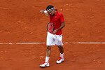 PARIS, FRANCE - JUNE 05:  Roger Federer of Switzerland reacts during the men's singles final match between Rafael Nadal of Spain and Roger Federer of Switzerland on day fifteen of the French Open at Roland Garros on June 5, 2011 in Paris, France.  (Photo by Alex Livesey/Getty Images)