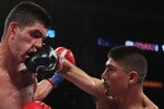 LOS ANGELES, CA - JUNE 04:  Mikey Garcia (R) connects with Rafael Guzman of Mexico during featherweight bout at Staples Center on June 4, 2011 in Los Angeles, California.  (Photo by Jeff Gross/Getty Images)