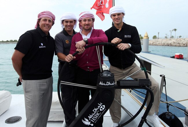 ABU DHABI, UNITED ARAB EMIRATES - JANUARY 18:  The 2010 Major winners (L-R) Phil Mickelson of the USA the 2010 Masters Champion, Louis Oosthuizen of South Africa the 2010 Open Champion, Graeme McDowell of Northern Ireland the 2010 US Open Champion, Martin Kaymer of Germany the 2010 PGA Champion behind the helm as they enjoyed a 30 minute sail on board the Abu Dhabi Ocean Racing entry for the 2011 Volvo Ocean Race as a preview for the 2011 Abu Dhabi HSBC Golf Championship to be held at the Abu Dhabi Golf Club on January 18, 2011 in Abu Dhabi, United Arab Emirates.  (Photo by David Cannon/Getty Images)