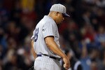 BOSTON, MA - MAY 21:  Carlos Zambrano #38 of the Chicago Cubs reacts after giving up a two run homer to David Ortiz outfield the Boston Red Sox on May 21, 2011 at Fenway Park in Boston, Massachusetts. Tonight the Chicago Cubs and the Boston Red Sox are wearing replica uniforms from 1918. Before this series, the two teams haven't played at Fenway Park since the 1918 World Series.  (Photo by Elsa/Getty Images)