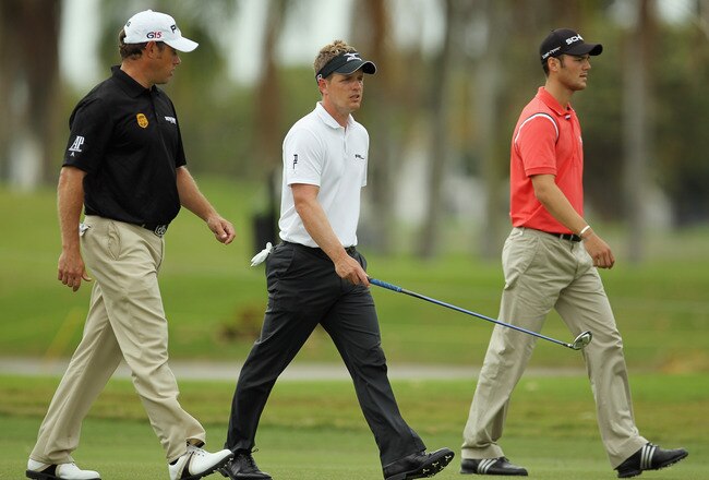 DORAL, FL - MARCH 10:  (R-L) Martin Kaymer of Germany, Luke Donald and Lee Westwood of England walk on the second hole during the first round of the 2011 WGC- Cadillac Championship at the TPC Blue Monster at the Doral Golf Resort and Spa on March 10, 2011 in Doral, Florida.  (Photo by Mike Ehrmann/Getty Images)