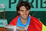 PARIS, FRANCE - JUNE 05:  Champion Rafael Nadal of Spain poses with the trophy following his victory during the men's singles final match between Rafael Nadal of Spain and Roger Federer of Switzerland on day fifteen of the French Open at Roland Garros on June 5, 2011 in Paris, France.  (Photo by Matthew Stockman/Getty Images)