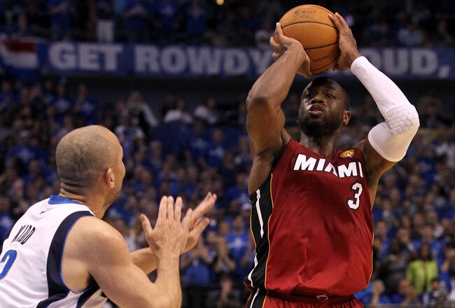 DALLAS, TX - JUNE 05:  Dwyane Wade #3 of the Miami Heat shoots over Jason Kidd #2 of the Dallas Mavericks in Game Three of the 2011 NBA Finals at American Airlines Center on June 5, 2011 in Dallas, Texas.  NOTE TO USER: User expressly acknowledges and agrees that, by downloading and/or using this Photograph, user is consenting to the terms and conditions of the Getty Images License Agreement.  (Photo by Ronald Martinez/Getty Images)