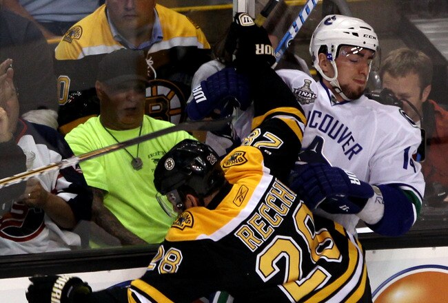 BOSTON, MA - JUNE 06:  Mark Recchi #28 of the Boston Bruins checks Alex Burrows #14 of the Vancouver Canucks during Game Three of the 2011 NHL Stanley Cup Final at TD Garden on June 6, 2011 in Boston, Massachusetts.  (Photo by Bruce Bennett/Getty Images)