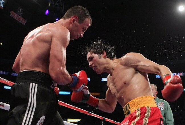 LOS ANGELES, CA - JUNE 04:  Julio Cesar Chavez Jr. (R) of Mexico throws a punnch at Sebastian Zbik of Germany during their WBC World Middleweight Title bout at Staples Center on June 4, 2011 in Los Angeles, California.  (Photo by Jeff Gross/Getty Images)