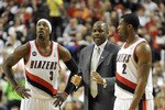 PORTLAND, OR - APRIL 28: (L to R) Gerald Wallace #3, head coach Nate McMillan and Wes Matthews #2 of the Portland Trail Blazers gather during a time out in the fourth quarter of Game Six of the Western Conference Quartefinals in the 2011 NBA Playsoffs on April 28, 2011 at the Rose garden in Portland, Oregon. The Mavericks won the game 103-96 to win the series and advance. NOTE TO USER: User expressly acknowledges and agrees that, by downloading and or using this photograph, User is consenting to the terms and conditions of the Getty Images License Agreement. (Photo by Steve Dykes/Getty Images)