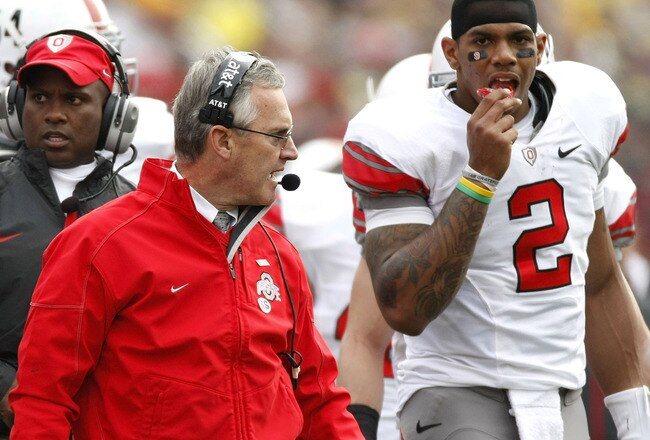 ANN ARBOR, MI - NOVEMBER 21: Head coach Jim Tressel of the Ohio State Buckeyes walks the sideline next to Terrelle Pryor #2 while playing the Michigan Wolverines on November 21, 2009 at Michigan Stadium in Ann Arbor, Michigan. Ohio State won the game 21-10. (Photo by Gregory Shamus/Getty Images)