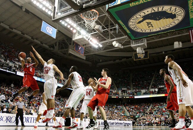 GREENSBORO, NC - MARCH 10: Jay Lewis #20 of the North Carolina State Wolfpack shoots against Jordan Williams #20 of the Maryland Terrapins during the first half of the game in the first round of the 2011 ACC men's basketball tournament at the Greensboro Coliseum on March 10, 2011 in Greensboro, North Carolina.  (Photo by Streeter Lecka/Getty Images)