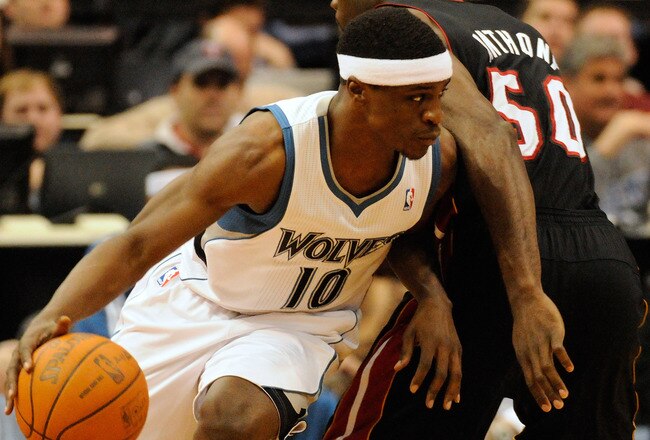 MINNEAPOLIS, MN - APRIL 1: Jonny Flynn #10 of the Minnesota Timberwolves dribbles around Joel Anthony #50 of the Miami Heat during a basketball game at Target Center on April 1, 2011 in Minneapolis, Minnesota. NOTE TO USER: User expressly acknowledges and agrees that, by downloading and or using this Photograph, user is consenting to the terms and conditions of the Getty Images License Agreement.  (Photo by Hannah Foslien /Getty Images)