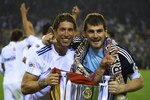 VALENCIA, BARCELONA - APRIL 20:  Iker Casillas (R) and Sergio Ramos of Real Madrid celebrate after the Copa del Rey final match between Real Madrid and Barcelona at Estadio Mestalla on April 20, 2011 in Valencia, Spain.  (Photo by Manuel Queimadelos Alonso/Getty Images)