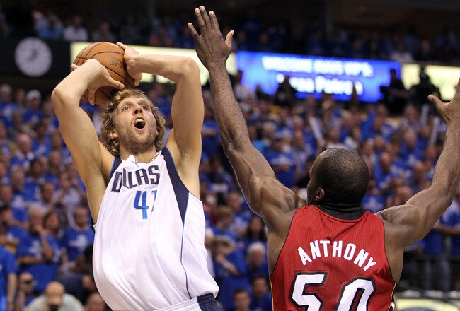 DALLAS, TX - JUNE 07:  Dirk Nowitzki #41 of the Dallas Mavericks makes the first basket of the game over Joel Anthony #50 of the Miami Heat in the first quarter in Game Four of the 2011 NBA Finals at American Airlines Center on June 7, 2011 in Dallas, Texas. NOTE TO USER: User expressly acknowledges and agrees that, by downloading and/or using this Photograph, user is consenting to the terms and conditions of the Getty Images License Agreement  (Photo by Ronald Martinez/Getty Images)