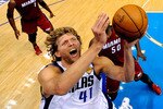 DALLAS, TX - JUNE 07:  Dirk Nowitzki #41 of the Dallas Mavericks attempts a shot against the Miami Heat in Game Four of the 2011 NBA Finals at American Airlines Center on June 7, 2011 in Dallas, Texas. NOTE TO USER: User expressly acknowledges and agrees that, by downloading and/or using this Photograph, user is consenting to the terms and conditions of the Getty Images License Agreement  (Photo by Larry W. Smith-Pool/Getty Images)