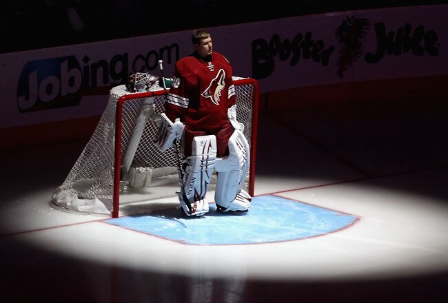 GLENDALE, AZ - APRIL 20:  Goaltender Ilya Bryzgalov #30 of the Phoenix Coyotes stands attended for the National Anthem before Game Four of the Western Conference Quarterfinals against the Detroit Red Wings during the 2011 NHL Stanley Cup Playoffs at Jobing.com Arena on April 20, 2011 in Glendale, Arizona.  The Red Wings defeated the Coyotes 6-3 to win the series 4-0.  (Photo by Christian Petersen/Getty Images)