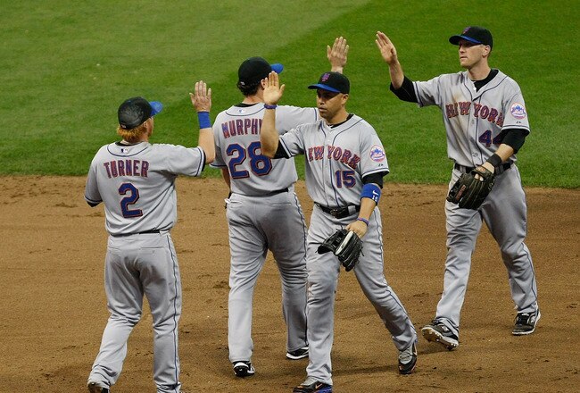 MILWAUKEE, WI - JUNE 7: Carlos Beltran #15 of the New York Mets congratulates Justin Turner #2, Daniel Murphy #28 and Jason Bay #44 after the win against the Milwaukee Brewers at Miller Park on June 7, 2011 in Milwaukee, Wisconsin. The Mets defeated the Brewers 2-1. (Photo by Scott Boehm/Getty Images)