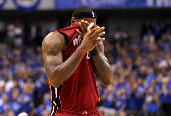 DALLAS, TX - JUNE 07:  LeBron James #6 of the Miami Heat wipes his face with his jersey against the Dallas Mavericks in Game Four of the 2011 NBA Finals at American Airlines Center on June 7, 2011 in Dallas, Texas. NOTE TO USER: User expressly acknowledges and agrees that, by downloading and/or using this Photograph, user is consenting to the terms and conditions of the Getty Images License Agreement  (Photo by Mike Ehrmann/Getty Images)