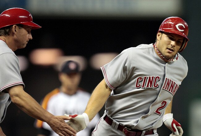 HOUSTON - JULY 24:  Chris Heisey #28 of the Cincinnati Reds is congratulated by third base coach Mark Berry after hitting a home run against the Houston Astros at Minute Maid Park on July 24, 2010 in Houston, Texas.  (Photo by Bob Levey/Getty Images)