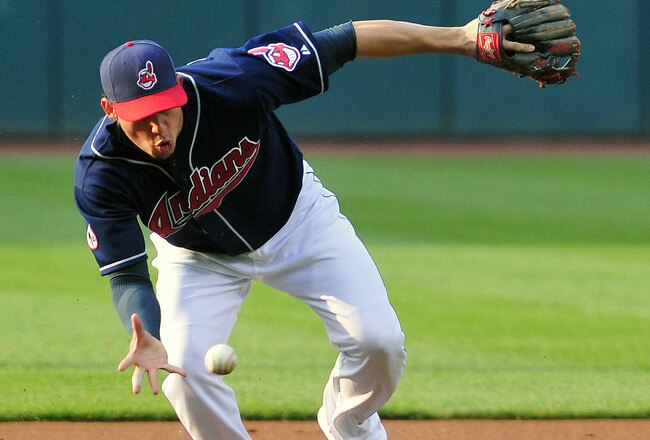 CLEVELAND, OH - JUNE 7: Asdrubal Cabrera #13 of the Cleveland Indians bare hands a ground ball during the first inning against the Minnesota Twins at Progressive Field on June 7, 2011 in Cleveland, Ohio. (Photo by Jason Miller/Getty Images)