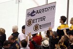 BOSTON, MA - JUNE 08:  A Boston Bruins fan holds a sign that reads, 'Scared??? Better Be!!!!!!!' during Game Four against the Vancouver Canucks in the 2011 NHL Stanley Cup Final at TD Garden on June 8, 2011 in Boston, Massachusetts.  (Photo by Bruce Bennett/Getty Images)