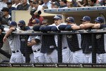 SAN DIEGO, CA - JUNE 8: San Diego Padres players look out from the dugout during the ninth inning of a baseball game against the Colorado Rockies at Petco Park on June 8, 2011 in San Diego, California. The Rockies won 5-3.  (Photo by Denis Poroy/Getty Images)