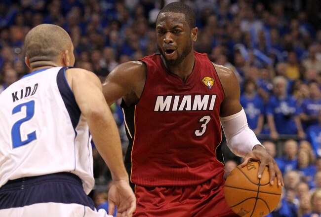 DALLAS, TX - JUNE 05:  Dwyane Wade #3 of the Miami Heat moves the ball against Jason Kidd #2 of the Dallas Mavericks in Game Three of the 2011 NBA Finals at American Airlines Center on June 5, 2011 in Dallas, Texas.  NOTE TO USER: User expressly acknowledges and agrees that, by downloading and/or using this Photograph, user is consenting to the terms and conditions of the Getty Images License Agreement.  (Photo by Ronald Martinez/Getty Images)