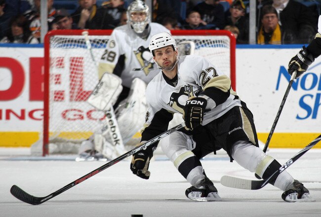 UNIONDALE, NY - DECEMBER 29:  Craig Adams #27 of the Pittsburgh Penguins skates against the New York Islanders at the Nassau Coliseum on December 29, 2010 in Uniondale, New York. The Islanders defeated the Penguins 2-1 in the shootout.  (Photo by Bruce Bennett/Getty Images)