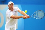 LONDON, ENGLAND - JUNE 09:  Andy Roddick of the United States returns the ball during his Men's Singles third round match against Kevin Anderson of South Africa on day four of the AEGON Championships at Queens Club on June 9, 2011 in London, England.  (Photo by Julian Finney/Getty Images)