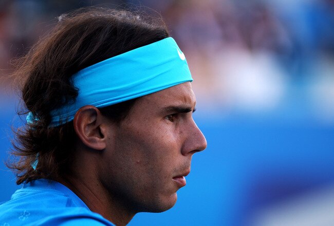 LONDON, ENGLAND - JUNE 07:  Rafael Nadal of Spain looks on during his Men's Doubles first round match with partner Marc Lopez of Spain against Thomaz Bellucci and Andre Sa of Brazil on day two of the AEGON Championships at Queens Club on June 7, 2011 in London, England.  (Photo by Clive Brunskill/Getty Images)