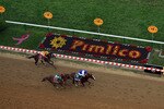 BALTIMORE, MD - MAY 21:  Jockey Jesus Castanon guides Shackleford #5 to victory over Animal Kingdom and jocky John Velazquez #11  and Astrology with jockey Mike Smith #1 to win the 136th running of the Preakness Stakes at Pimlico Race Course on May 21, 2011 in Baltimore, Maryland.  (Photo by Rob Carr/Getty Images)