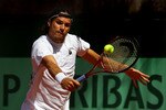 PARIS, FRANCE - MAY 23:  Tommy Haas of Germany plays a backhand during the men's singles round one match between Tommy Haas of Germany and Marsel Ilhan of Turkey on day two of the French Open at Roland Garros on May 23, 2011 in Paris, France.  (Photo by Alex Livesey/Getty Images)