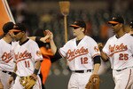 BALTIMORE, MD - JUNE 08: Mark Reynolds #12 of the Baltimore Orioles celebrates with teammates after the Orioles beat the Oakland Athletics 3-2 to sweep the series at Oriole Park at Camden Yards on June 8, 2011 in Baltimore, Maryland.  (Photo by Rob Carr/Getty Images)