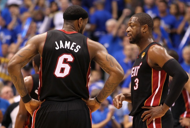 DALLAS, TX - JUNE 09:  LeBron James #6 and Dwyane Wade #3 of the Miami Heat talk on court against the Dallas Mavericks in Game Five of the 2011 NBA Finals at American Airlines Center on June 9, 2011 in Dallas, Texas.  NOTE TO USER: User expressly acknowledges and agrees that, by downloading and/or using this Photograph, user is consenting to the terms and conditions of the Getty Images License Agreement.  (Photo by Mike Ehrmann/Getty Images)