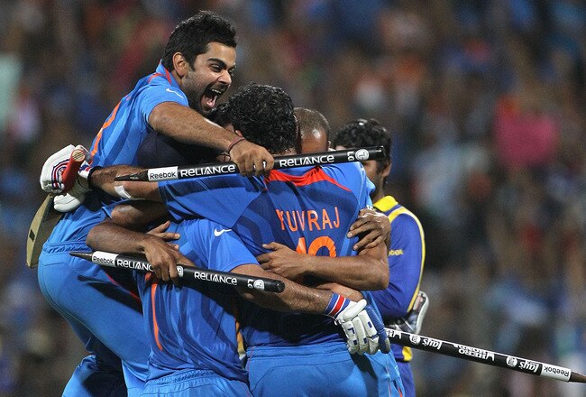 MUMBAI, INDIA - APRIL 02:  The Indian team celebrate on the field after MS Dhoni hit a six to win the match during the 2011 ICC World Cup Final between India and Sri Lanka at Wankhede Stadium on April 2, 2011 in Mumbai, India.  (Photo by Hamish Blair/Getty Images)
