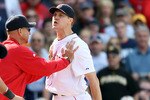 BOSTON, MA - JUNE 04:  Jonathan Papelbon #58 of the Boston Red Sox is held back by manager Terry Francona #47 in the ninth inning against the Oakland Athletics on June 4, 2011 at Fenway Park in Boston, Massachusetts.  (Photo by Elsa/Getty Images)