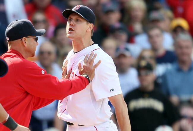 BOSTON, MA - JUNE 04:  Jonathan Papelbon #58 of the Boston Red Sox is held back by manager Terry Francona #47 in the ninth inning against the Oakland Athletics on June 4, 2011 at Fenway Park in Boston, Massachusetts.  (Photo by Elsa/Getty Images)