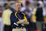 GLENDALE, AZ - JANUARY 02:  Interim head coach Bill Stewart of the West Virginia Mountaineers looks on during warmups before taking on the Oklahoma Sooners at the Tostito's Fiesta Bowl at University of Phoenix Stadium January 2, 2008 in Glendale, Arizona.  (Photo by Doug Pensinger/Getty Images)