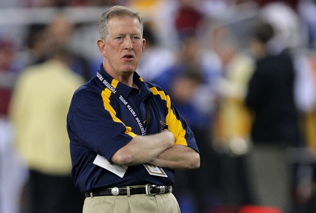 GLENDALE, AZ - JANUARY 02:  Interim head coach Bill Stewart of the West Virginia Mountaineers looks on during warmups before taking on the Oklahoma Sooners at the Tostito's Fiesta Bowl at University of Phoenix Stadium January 2, 2008 in Glendale, Arizona.  (Photo by Doug Pensinger/Getty Images)