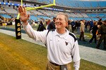 CHARLOTTE, NC - DECEMBER 27:  Head coach Bill Stewart of the West Virginia Mountaineers celebrates after a 31-30 victory over the North Carolina Tar Heels after the Meineke Car Care Bowl on December 27, 2008 at Bank of America Stadium in Charlotte, North Carolina.  (Photo by Streeter Lecka/Getty Images)