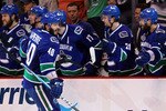 VANCOUVER, BC - JUNE 10:  Maxim Lapierre #40 of the Vancouver Canucks celebrates with his team after scoring a goal in the third period against the Boston Bruins during Game Five of the 2011 NHL Stanley Cup Final at Rogers Arena on June 10, 2011 in Vancouver, British Columbia, Canada.  (Photo by Bruce Bennett/Getty Images)