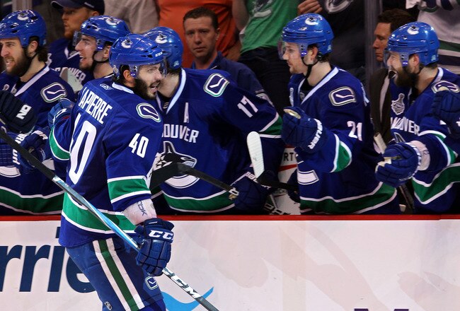 VANCOUVER, BC - JUNE 10:  Maxim Lapierre #40 of the Vancouver Canucks celebrates with his team after scoring a goal in the third period against the Boston Bruins during Game Five of the 2011 NHL Stanley Cup Final at Rogers Arena on June 10, 2011 in Vancouver, British Columbia, Canada.  (Photo by Bruce Bennett/Getty Images)
