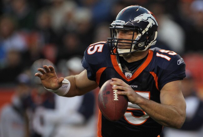 DENVER - DECEMBER 26:  Quarterback Tim Tebow #15 of the Denver Broncos rolls out and looks to deliver a pass against the Houston Texas at INVESCO Field at Mile High on December 26, 2010 in Denver, Colorado. The Broncos defeated the Texans 24-23.  (Photo by Doug Pensinger/Getty Images)