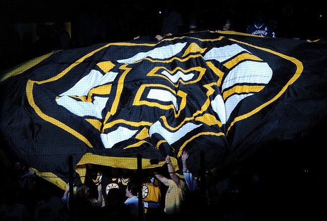 BOSTON, MA - JUNE 08:  Boston Bruins fans wave a giant Bruins flag prior to the start of Game Four between the Boston Bruins and the Vancouver Canucks in the 2011 NHL Stanley Cup Final at TD Garden on June 8, 2011 in Boston, Massachusetts.  (Photo by Harry How/Getty Images)