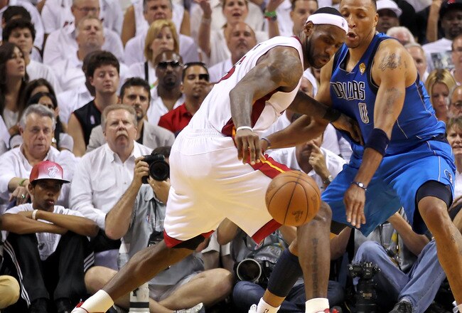 MIAMI, FL - JUNE 12:  LeBron James #6 of the Miami Heat loses his dribble as he is defended by Shawn Marion #0 of the Dallas Mavericks in the second half of Game Six of the 2011 NBA Finals at American Airlines Arena on June 12, 2011 in Miami, Florida. NOTE TO USER: User expressly acknowledges and agrees that, by downloading and/or using this Photograph, user is consenting to the terms and conditions of the Getty Images License Agreement.  (Photo by Mike Ehrmann/Getty Images)