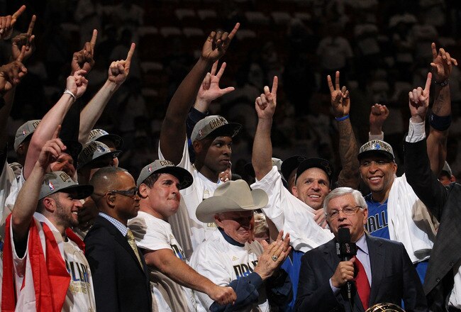MIAMI, FL - JUNE 12:  NBA Commissioner David Stern presents the Larry O'Brien trophy to the Dallas Mavericks founder Don J. Carter next to team owner Mark Cuban after the Mavericks won 105-95 against the Miami Heat in Game Six of the 2011 NBA Finals at American Airlines Arena on June 12, 2011 in Miami, Florida. NOTE TO USER: User expressly acknowledges and agrees that, by downloading and/or using this Photograph, user is consenting to the terms and conditions of the Getty Images License Agreement.  (Photo by Ronald Martinez/Getty Images)
