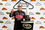 LONG POND, PA - JUNE 12:  Jeff Gordon, driver of the #24 DuPont Chevrolet, celebrates with the trophy after winning the NASCAR Sprint Cup Series 5-Hour Energy 500 at Pocono Raceway on June 12, 2011 in Long Pond, Pennsylvania.  (Photo by Geoff Burke/Getty Images for NASCAR)