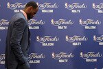 MIAMI, FL - JUNE 12:  LeBron James #6 of the Miami Heat walks into the interview room to answer questions after the Heat were defeated 105-95 by the Dallas Mavericks in Game Six of the 2011 NBA Finals at American Airlines Arena on June 12, 2011 in Miami, Florida. NOTE TO USER: User expressly acknowledges and agrees that, by downloading and/or using this Photograph, user is consenting to the terms and conditions of the Getty Images License Agreement.  (Photo by Mike Ehrmann/Getty Images)