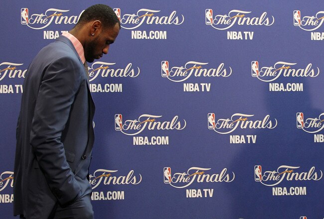 MIAMI, FL - JUNE 12:  LeBron James #6 of the Miami Heat walks into the interview room to answer questions after the Heat were defeated 105-95 by the Dallas Mavericks in Game Six of the 2011 NBA Finals at American Airlines Arena on June 12, 2011 in Miami, Florida. NOTE TO USER: User expressly acknowledges and agrees that, by downloading and/or using this Photograph, user is consenting to the terms and conditions of the Getty Images License Agreement.  (Photo by Mike Ehrmann/Getty Images)
