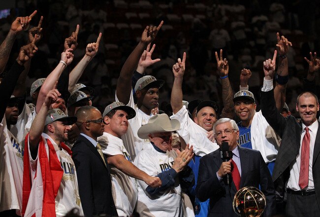 MIAMI, FL - JUNE 12:  NBA Commissioner David Stern presents the Larry O'Brien trophy to the Dallas Mavericks founder Don J. Carter next to team owner Mark Cuban after the Mavericks won 105-95 against the Miami Heat in Game Six of the 2011 NBA Finals at American Airlines Arena on June 12, 2011 in Miami, Florida. NOTE TO USER: User expressly acknowledges and agrees that, by downloading and/or using this Photograph, user is consenting to the terms and conditions of the Getty Images License Agreement.  (Photo by Ronald Martinez/Getty Images)