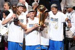 MIAMI, FL - JUNE 12:  (L-R) Dirk Nowitzki #41, Jason Kidd #2, Jason Terry #31 and Shawn Marion #0 of the Dallas Mavericks celebrate with the Larry O'Brien trophy after they won 105-95 against the Miami Heat in Game Six of the 2011 NBA Finals at American Airlines Arena on June 12, 2011 in Miami, Florida. NOTE TO USER: User expressly acknowledges and agrees that, by downloading and/or using this Photograph, user is consenting to the terms and conditions of the Getty Images License Agreement.  (Photo by Marc Serota/Getty Images)